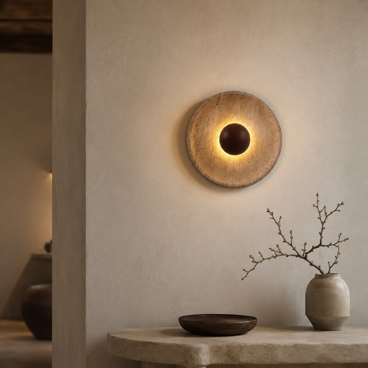Lumiris sculptural wall light in travertine and wood, soft textured light, artistic design.