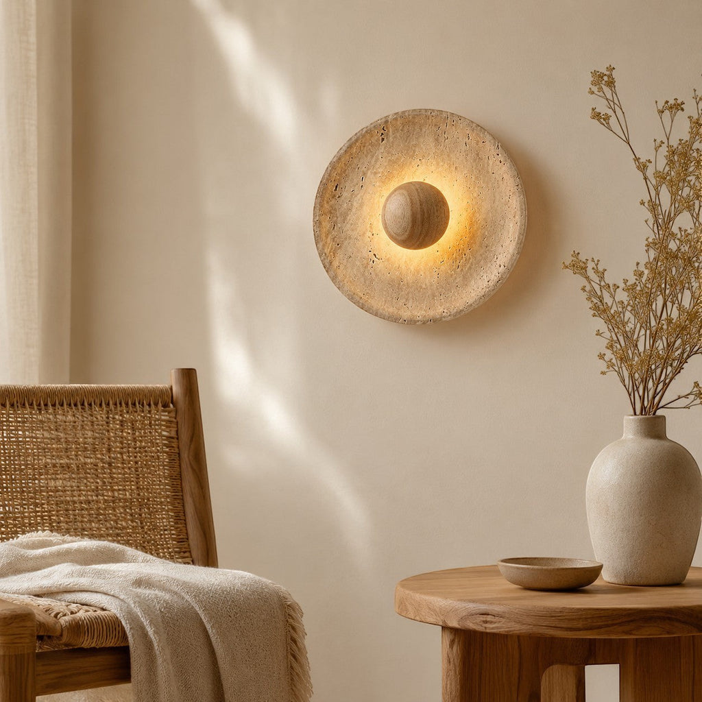 Lumiris sculptural wall light in travertine and wood, soft textured light for a modern interior.
