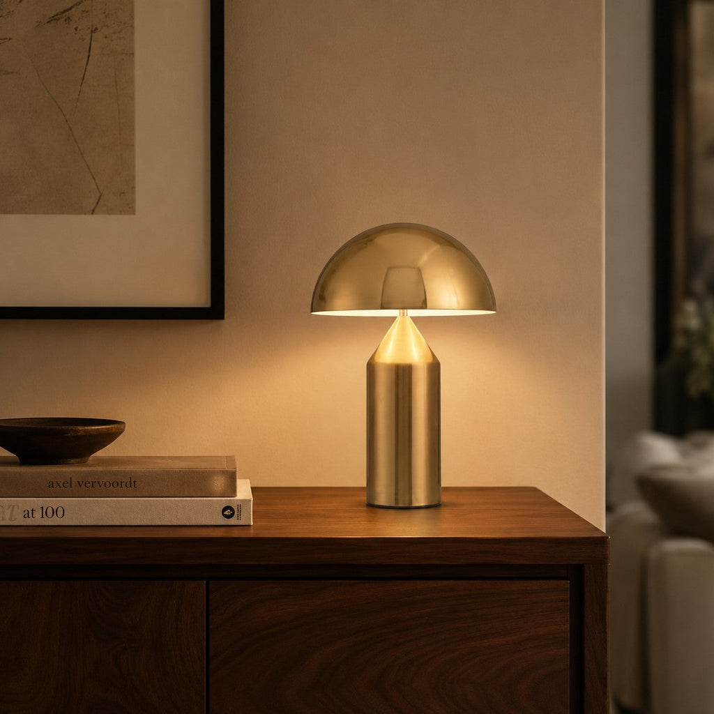 Lumiris mushroom table lamp in gold metal, modern design for a home office or bedroom.