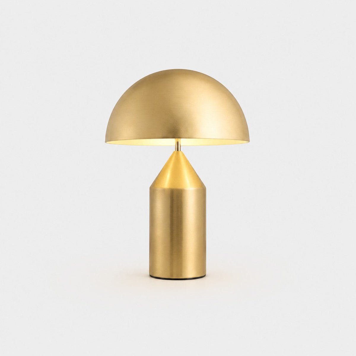 Lumiris mushroom table lamp in gold metal, modern design for a home office or bedroom.