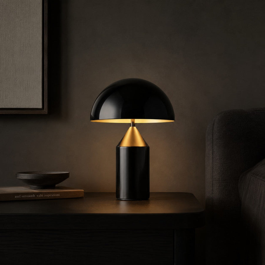 Lumiris mushroom table lamp in black and gold metal, modern design for a home office or bedroom.