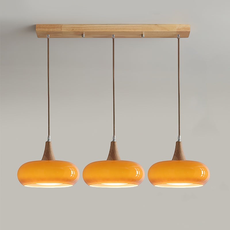 Lumiris wood and amber glass pendant light, 3 oval orange shades, modern design for a dining room