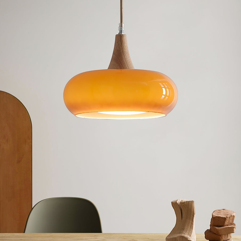 Lumiris amber glass pendant light with a wooden top, warm ambient lighting, modern style.