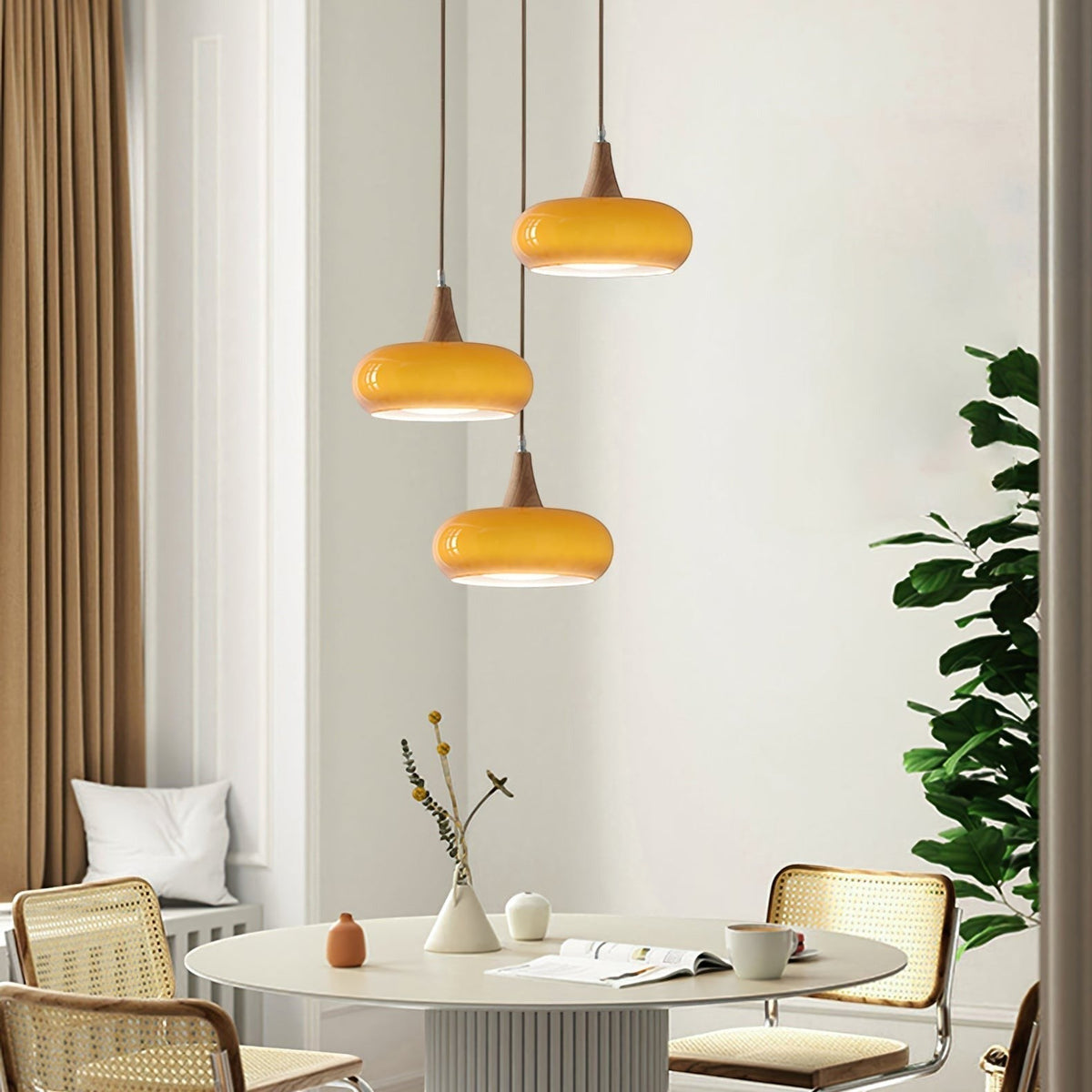 Lumiris amber glass and wood pendant light, modern design, warm lighting for a dining room or living room.