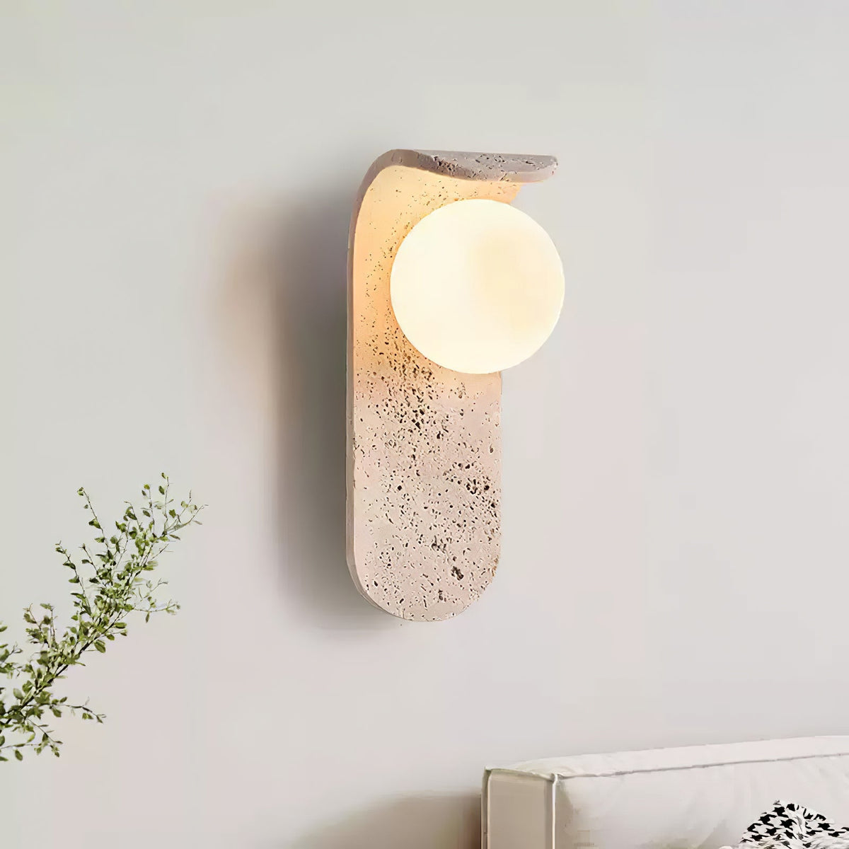 Travertine wall light with an opal glass globe on a curved arm (2)