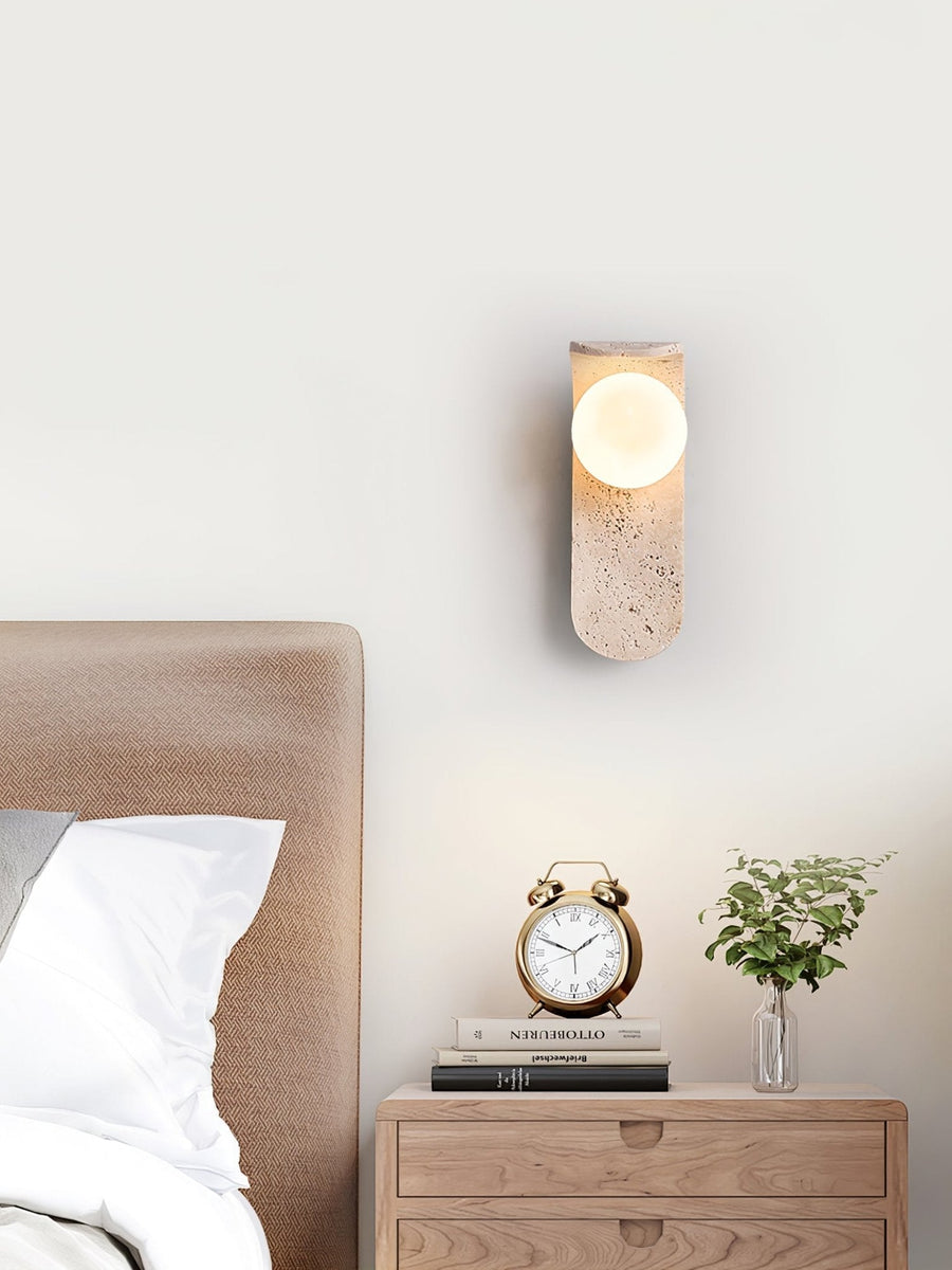 Travertine wall light with an opal glass globe on a curved arm (3)