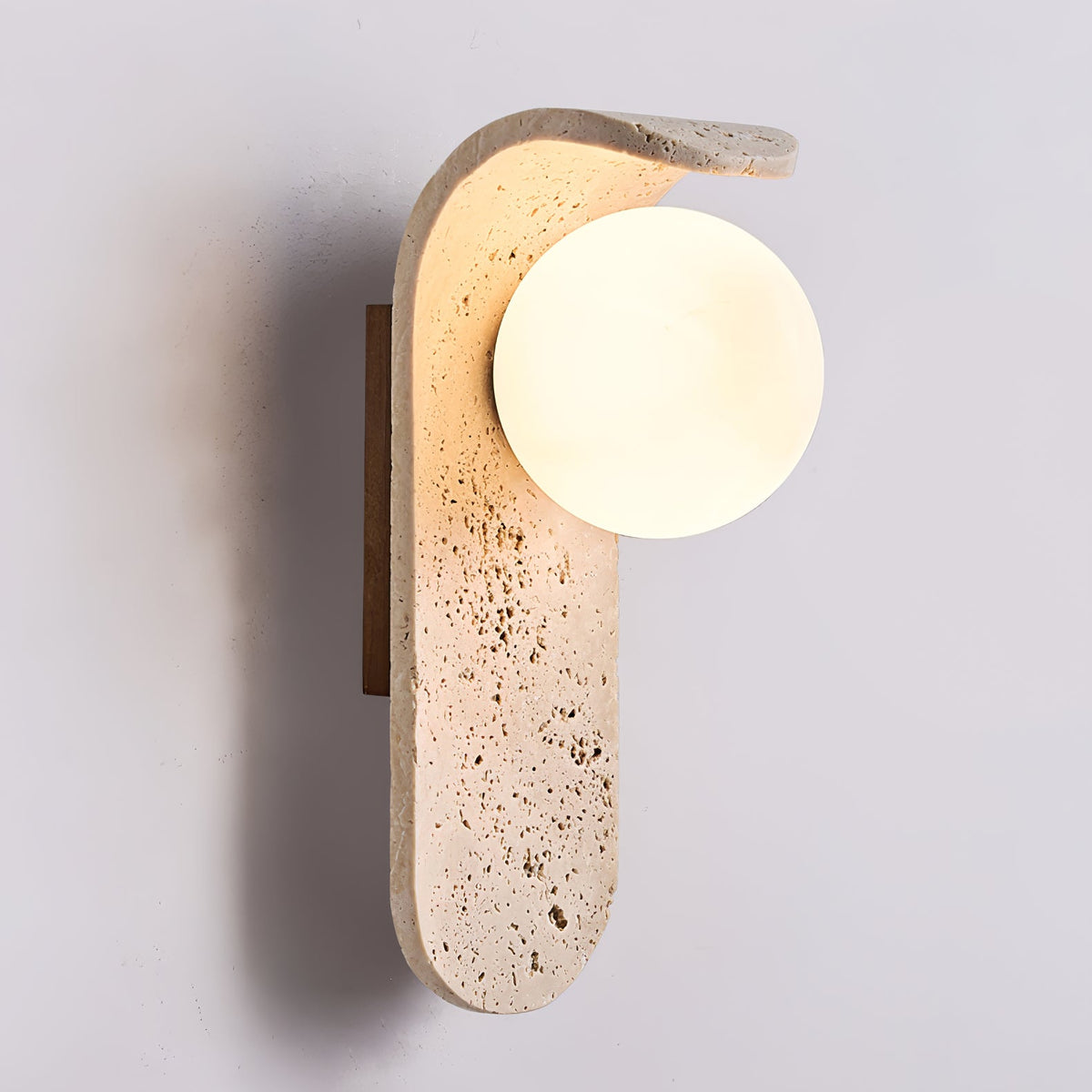 Travertine wall light with an opal glass globe on a curved arm (5)